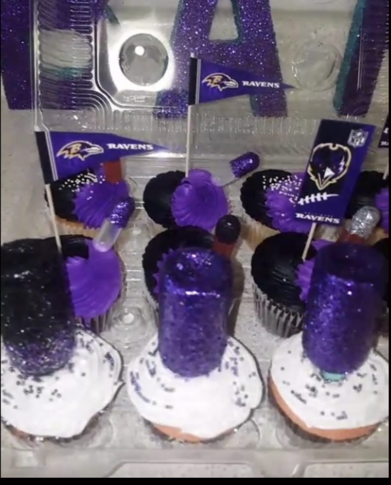 Baltimore Ravens themed cupcakes with purple glitter decoration